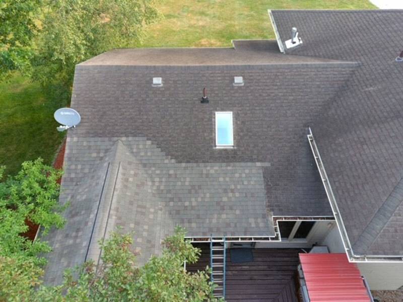 Aerial view of the roof of a house with small sunroof